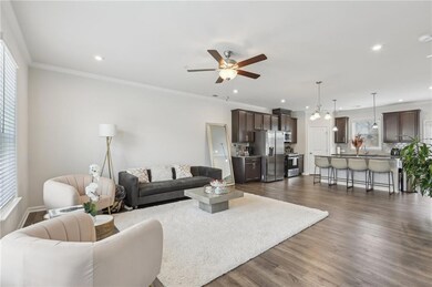 Living area with ornamental molding, dark wood fin