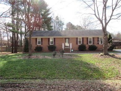 Ranch-style house featuring a front lawn