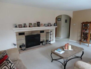 Living Room. The arched doorway leads to the foyer
