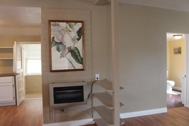 Dining and Living room, propane wall heater.