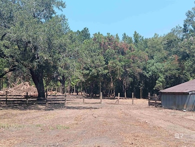 View of yard featuring a view of trees