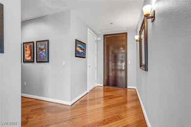 Corridor featuring light wood-style floors and baseboards