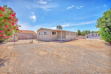 Rear view of property featuring fence