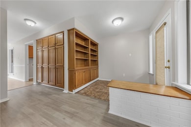 Unfurnished dining area with light wood-style floo
