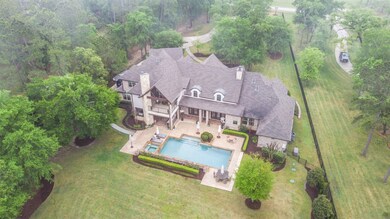 Only 1 neighbor! 2.5 acres - 2 lots 1.0 acre and 1.5 acres that the house sits on. Located on hole #2 Fairway of Highly Acclaimed High Meadow Estates! Generator plus Well for irrigation and pool! 4 Car Garage! Cul De Sac location! Tons of covered patio and balcony space for real outdoor living!