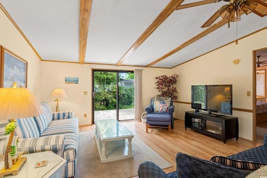 Living room with wood finished floors, ornamental 