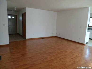 Living Room. Spacious living room opens to dining 