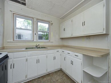 Kitchen leads to the back yard