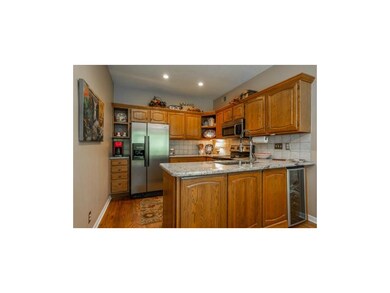 Continue to the fully-equipped eat-in kitchen with