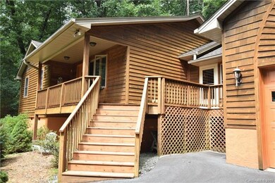 Steps off the driveway to the front porch and deck