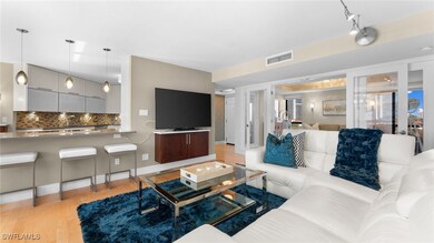 Living room with light hardwood / wood-style floor