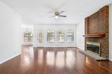 Unfurnished living room featuring a ceiling fan, 