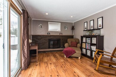 Spacious family room with wood burning fireplace.