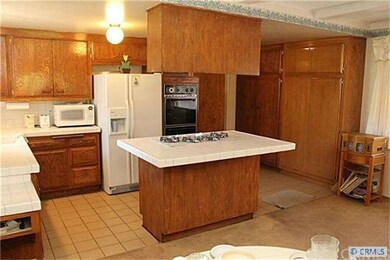 Another view of Kitchen, generous cabinet space.