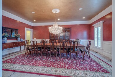 The formal dining room is large enough to comfortably feed a crowd. Several of its top-notch features are found throughout the ground floor, including stone floors, solid wood casing, and high ceilings with built-in speakers. 