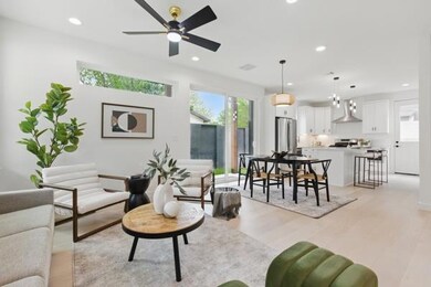Living room featuring light wood-style floors, re