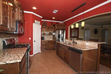 Kitchen has abundant storage, pantry, granite coun