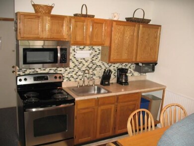 Kitchen with new appliances and back...
