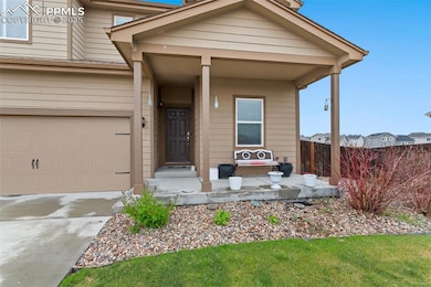 View of front of house featuring concrete driveway