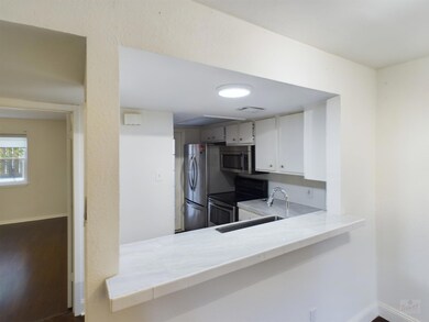 Kitchen featuring stainless steel appliances, lig