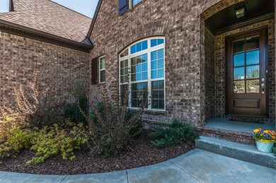 Beautiful 9' entry door & covered porch welcome you home.
