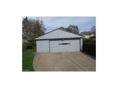This 2.5 car garage has a gable roof, electric gar