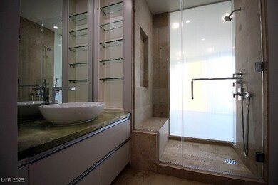 Bathroom featuring a stall shower and vanity