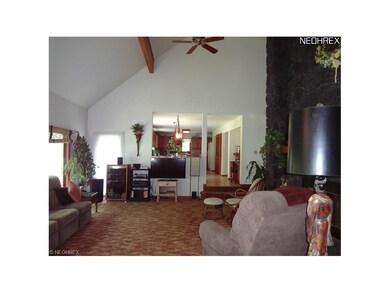 The large vaulted family room has a window wall an