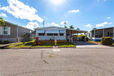 View of front of home featuring a carport and a fr