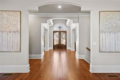 View from great room through foyer to double-door 