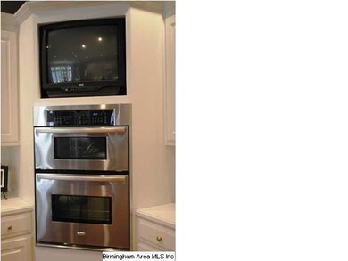 Kitchen has double ovens PLUS microwave and gas co