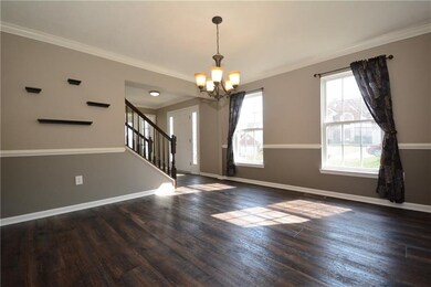 To the left of the entry hall and stairs is a form