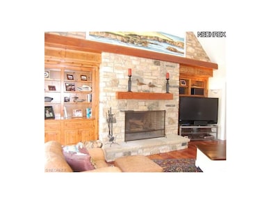 Family room with massive stone fireplace and built