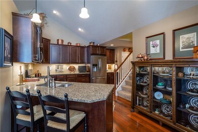 Designer cook's kitchen featuring granite countertops. Wellborn custom wood cabinetry & Brazilian cherry floors