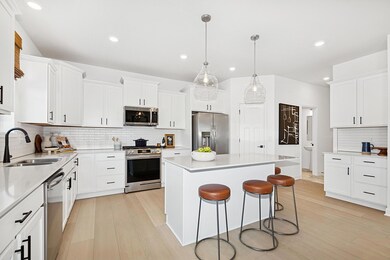 (Photo of a decorated model, actual homes finishes will vary) Another view of the gourmet kitchen.