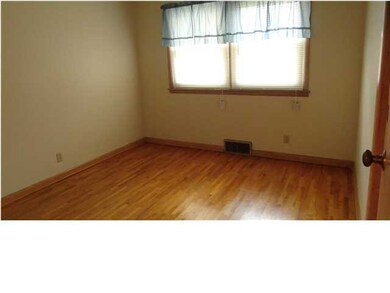 Bedroom 2 shows wood floors