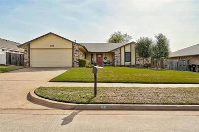 View of front of house with a front lawn, driveway