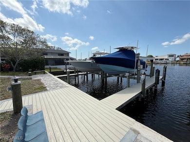 Dock area with boat lift and a water view