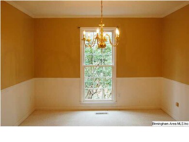 The formal dining room is ideal for family gatheri