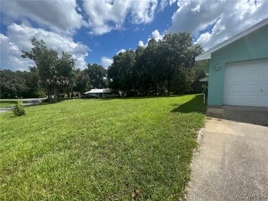 On half acre to the left of house is included