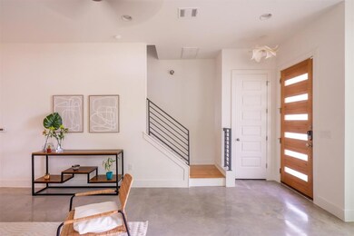 Entrance foyer featuring visible vents, baseboard