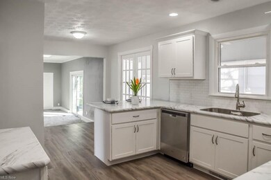 Kitchen opens to dinette and great room.