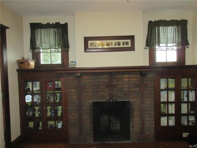 Living room with fireplace and beautiful woodwork,