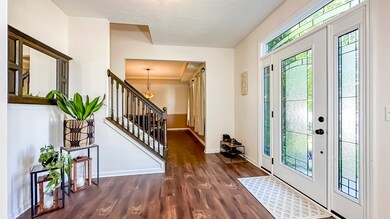 Let there be light! The new front door with sidelights fills the entry with natural light.