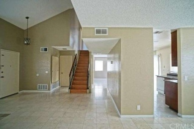 view of stair and kitchen