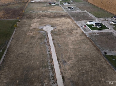 Aerial view of property and surrounding area featuring rural landscape