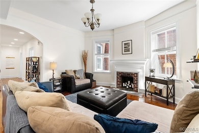 The living room is aglow with natural light and bu