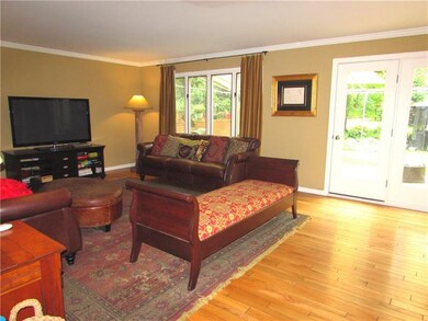 The Spacious Family Room is adorned with Hardwood 