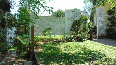Behind this fence with road frontage of 70 feet is an exquisite landscaped and fully appointed oasis! No pond but definitely everything else on .40 acres in Burlington Vermont. The home or property can have another unit. So make the home a duplex or 