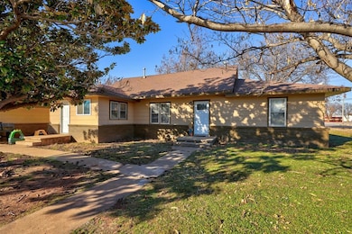 Ranch-style home with a front yard